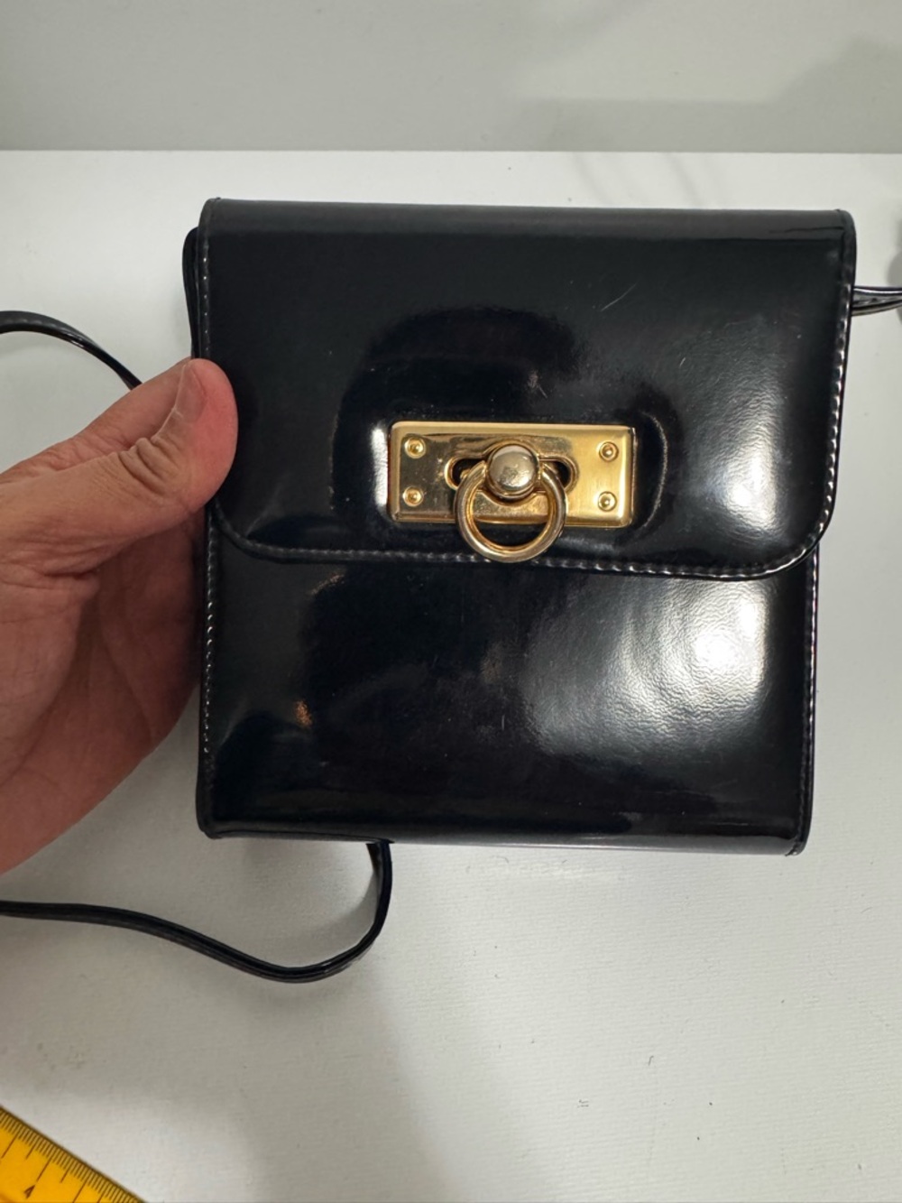 Black Patent Crossbody Bag with Gold Ring Accent